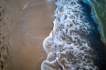 Wall Mural - the waves of the sea wash up on a beach