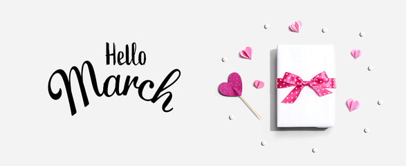 Wall Mural - Hello March message with a gift box and paper hearts