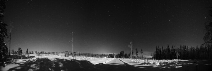 Wall Mural - monochrome grungy night panorama of small swedish town and road in winter, the town name granbergsli