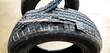 Torn car tire close up. Big hole