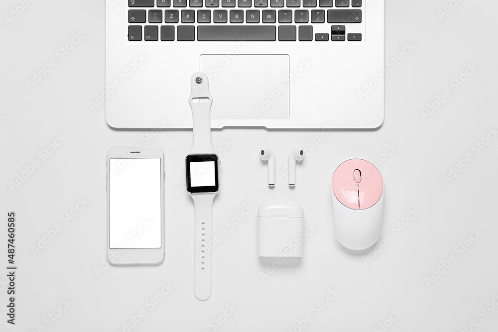 Composition with mobile phone, laptop and modern gadgets on white background