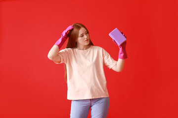 Wall Mural - Young woman with sponge on color background