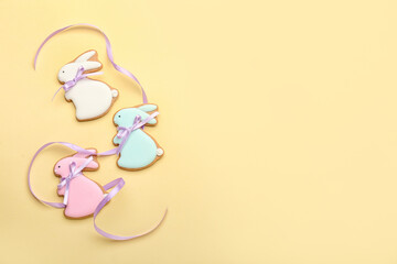 Sticker - Delicious Easter cookies in shape of bunny on beige background