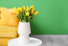 Vase With Beautiful Tulips On Table In Room Interior
