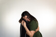 © Antonio Tanaka - portrait of a couple hugging very much in love on a white background