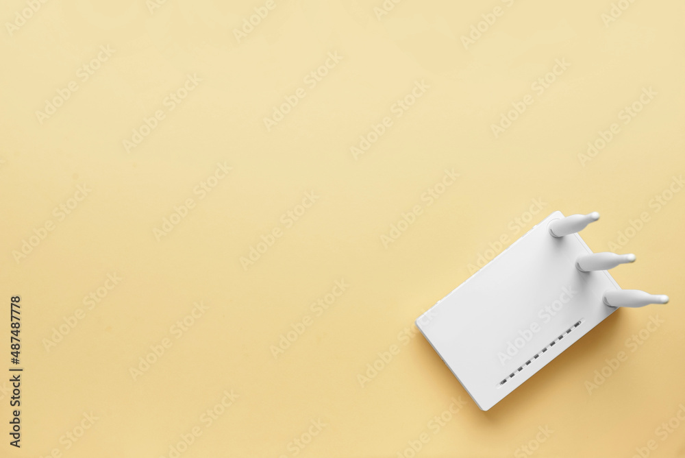 White wi-fi router on color background