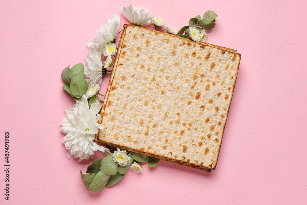 Jewish flatbread with flowers on color background