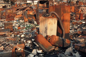 Kitchen after fire, rusty gas cylinder