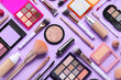 © Pixel-Shot - Beautiful makeup brushes with decorative cosmetics on lilac background
