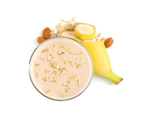 Glass of tasty banana smoothie with almonds and oatmeal on white background, top view