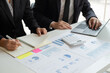 © Orathai - Business leaders talk about charts, financial graphs showing results are analyzing and calculating planning strategies, business success building processes