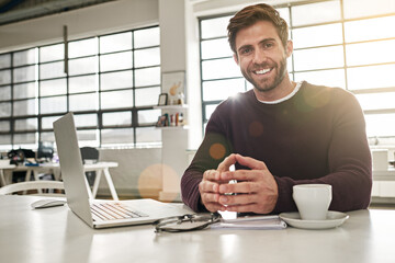 Aufkleber - This smile is testament to my success. Portrait of a young businessman working at his desk in a modern office.