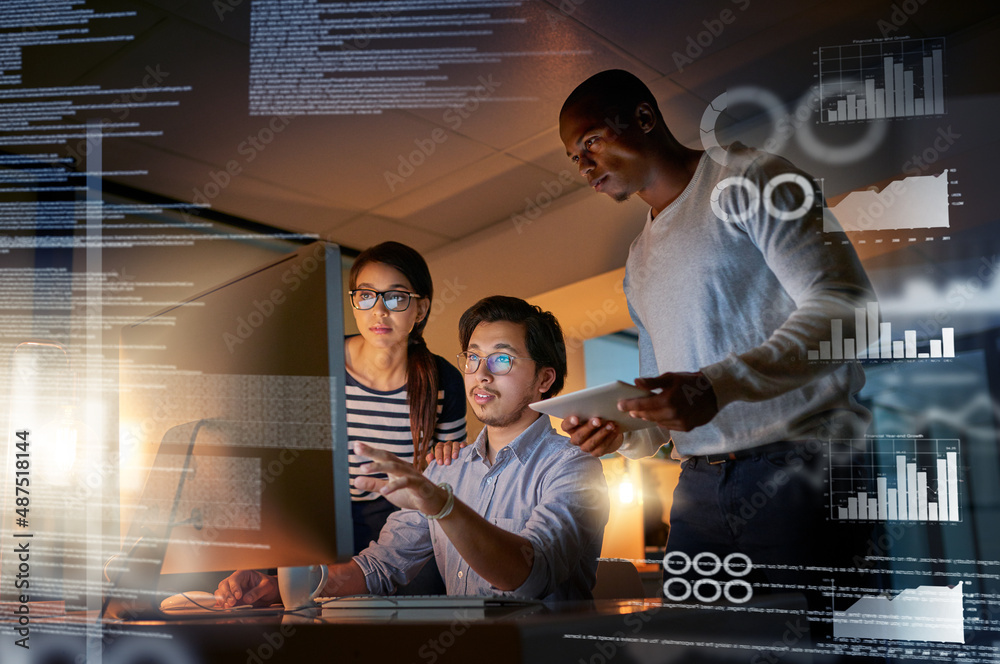 Cracking codes no matter the time. Shot of computer programmers looking ...