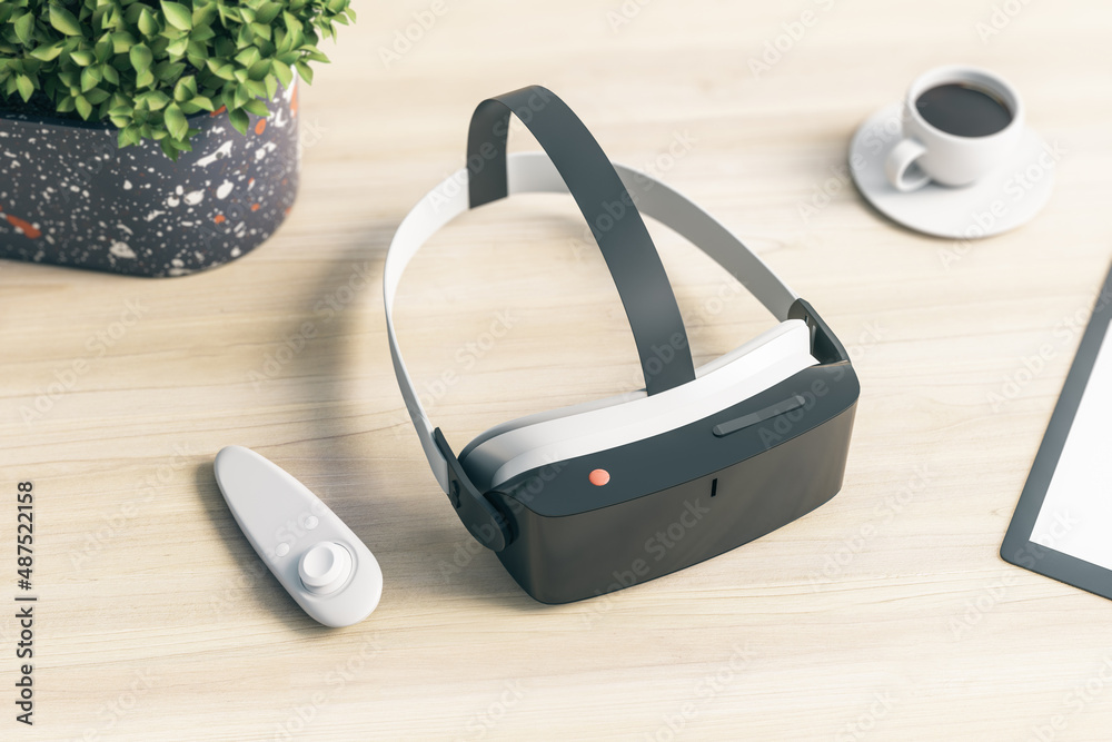 Close up of VR glasses on blurry wooden office desktop with plant and ...
