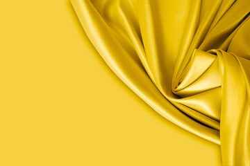 Wall Mural - Beautiful elegant wavy yellow satin silk luxury cloth fabric with monochrome background design. Copy space