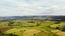 Drone Timelapse Over Patchwork Fields In North York Moors With Clouds