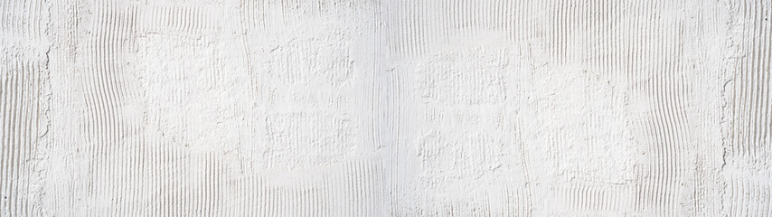 White rough filler plaster facade wall texture background.banner panorama, with vertical line corrugation
