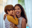 © Arnéll K/peopleimages.com - Hey mom guess what I love you. Shot of an adorable little boy whispering into his mothers ear.