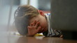© Marco - Angry little boy lying on floor feeling upset and boredom at home