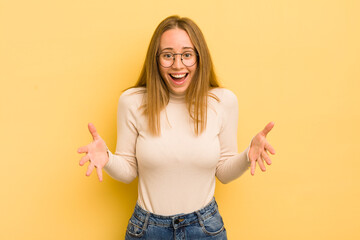 pretty caucasian woman feeling happy, astonished, lucky and surprised, like saying omg seriously? Unbelievable