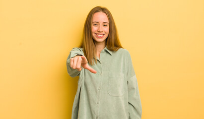 Sticker - pretty caucasian woman pointing at camera with a satisfied, confident, friendly smile, choosing you