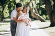 © Petro - Young couple with their baby daughter in park