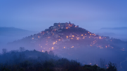 Wall Mural - The fortified medieval town of Cordes sur Ciel in Occitanie at sunrise with 