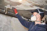 Fototapeta  - fire damage and restoration indoor interior. removing damaged paint layer