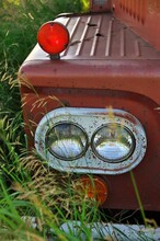 Close Up Of Headlight Of An Abandoned Vintage And Rusty Truck