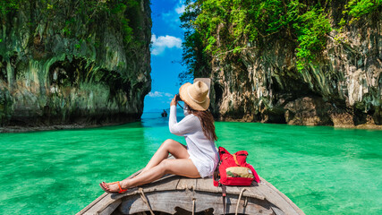 Wall Mural - Traveler woman on boat with camera joy nature scenic landscape Ko Hong island Krabi, Attraction famous place tourist travel Phuket Thailand summer holiday vacation trip, Beautiful destination Asia