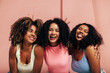 © Artem Varnitsin - Portrait of three laughing females with curly hair. Happy women having fun together looking at camera.