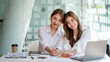 Two pretty Young Asian businesswoman or intern who sitting smile happily in the office. Looking at camera