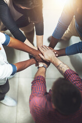 Poster - Taking it to the top together. Cropped shot of a work group joining hands in solidarity.