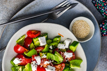 Overhead View Of A Bowl Of Fresh Greek Salad With Sesame Seeds