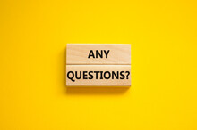Any Questions Symbol. Concept Words Any Questions On Wooden Blocks On A Beautiful Yellow Table Yellow Background. Business And Any Questions Q And A Concept, Copy Space.