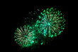 © oksanamedvedeva - green fireworks on a black background. Festive Christmas lighting element for decoration. Sparks. Fireworks Are A Class Of Explosive Pyrotechnic Devices Used For Aesthetic Purposes. Isolated