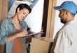 © Yuri Arcurs/peopleimages.com - Just sign and the package is yours. Shot of a young woman standing at her front door signing for a package from a courier.