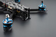 Quadcopter with carbon frame, motors on a dark background.