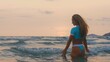 © ivandanru - SLOW MOTION GLOW MIST DARK SILHOUETTE CINEMATIC VIEW: Sexy hot woman standing on water sea. Girl stand in turquoise swimsuit. Freedom paradise holiday vacation summer beach, seaside landscape concept