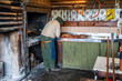 Argentina, Patagonia, traditional lamb barbecue (asado)  the cook (asador) cutting the meat.
