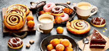 Table With Various Cookies, Donuts, Cakes And Coffe Cups