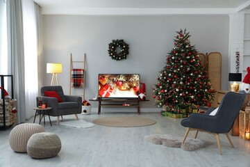 Sticker - Stylish living room interior with modern TV and Christmas tree