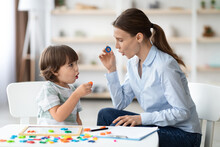 Female Speech Therapist Curing Child's Problems And Impediments. Little Boy Learning Letter O With Private Tutor
