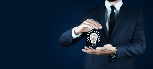 Sticker - Hand of businessman holding illuminated light bulb