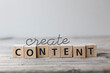 © epiximages - Create Content strategy Concept. Conent wording on wooden cubes.