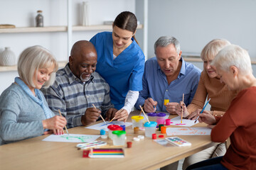 Creative senior men and women doing arts and crafts together