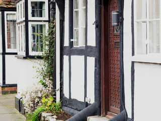 Sticker - England UK. Traditional houses and cottages in an English Village. Suitable for articles on housing market, finance, mortgage, cost of living etc. Generic property image.