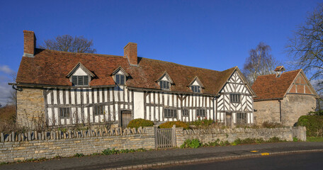 Sticker - England UK. Traditional houses and cottages in an English Village. Suitable for articles on housing market, finance, mortgage, cost of living etc. Generic property image.