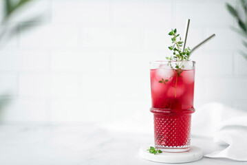 berry juice from blackcurrant and cranberries with ice in a glass