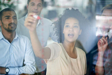 Poster - helping them to visualize her thought process. shot of a group of creative businesspeople plotting o